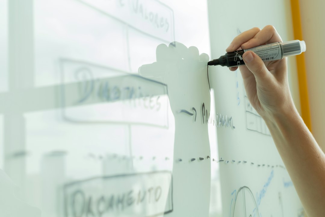 Software team designing AI agent workflows on a whiteboard