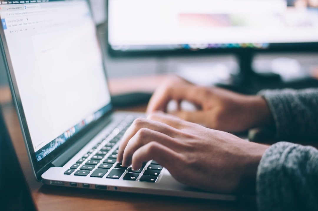 Writer using an AI content creation tool on a laptop