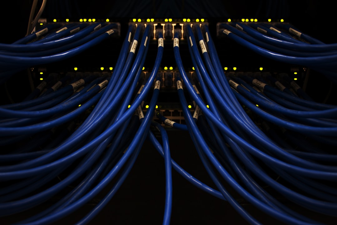 Technician inspecting servers and cooling hardware in a data center