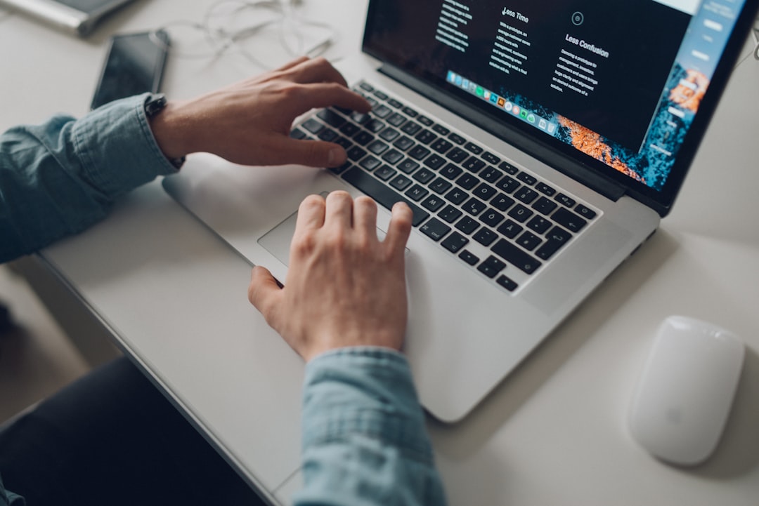 Person fact-checking AI headlines on a laptop, illustrating critical thinking about media