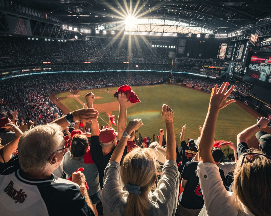Fans in a stadium using mobile devices and digital tickets
