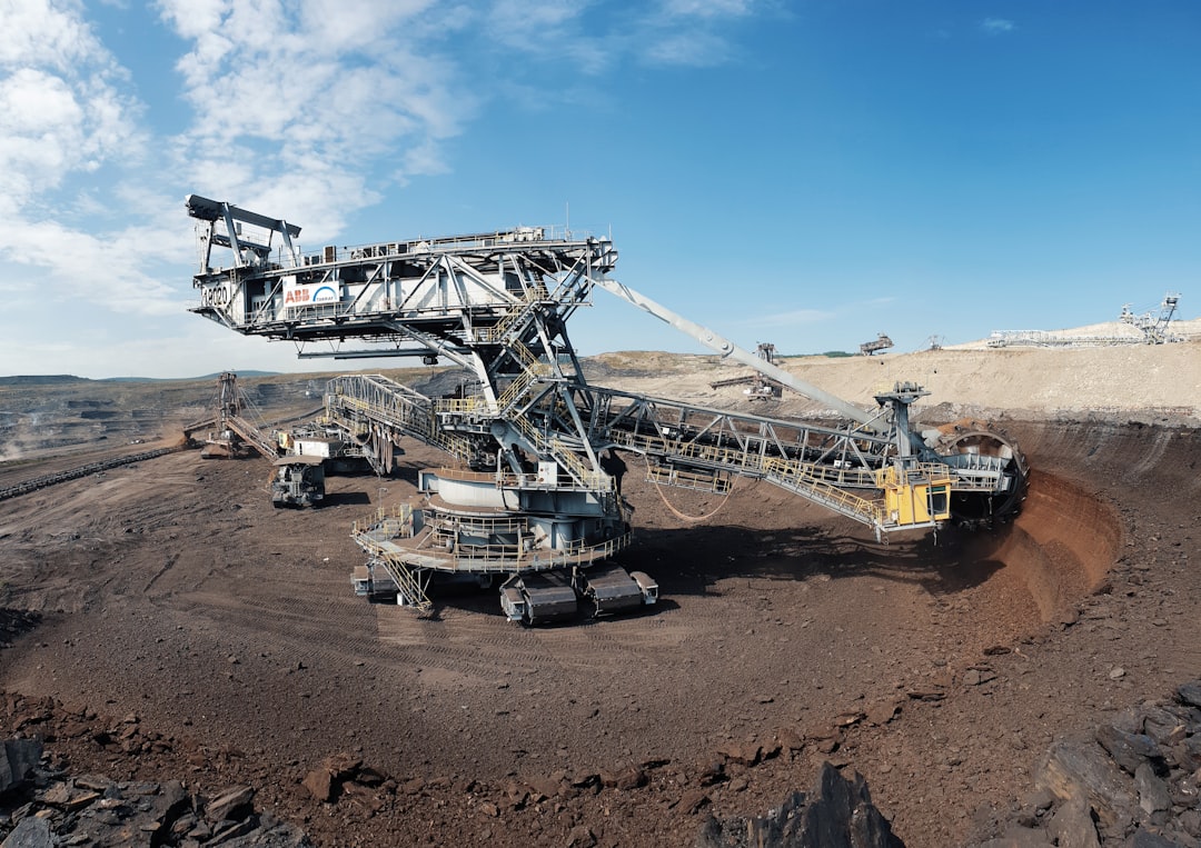Autonomous mining trucks and conveyors operating in a large open-pit mine