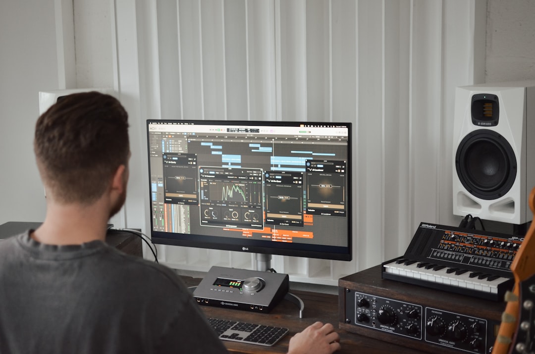User creating AI-generated music on a laptop