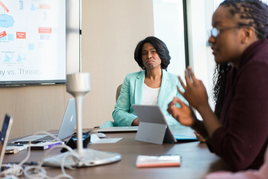 Executives in a meeting discussing AI strategy and productivity goals