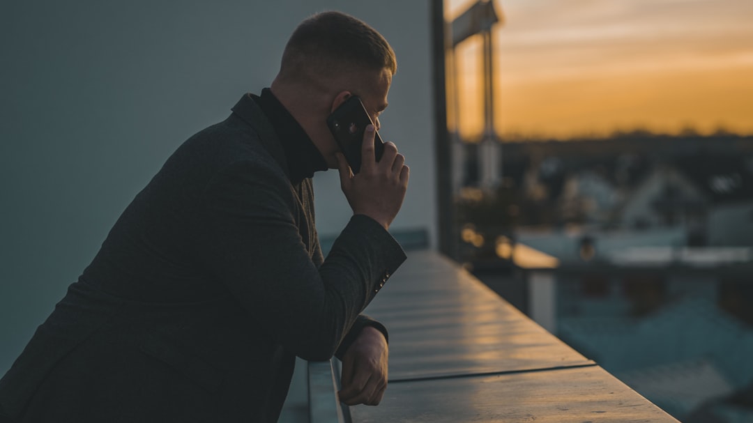 Person answering a suspicious phone call that may be an AI voice scam