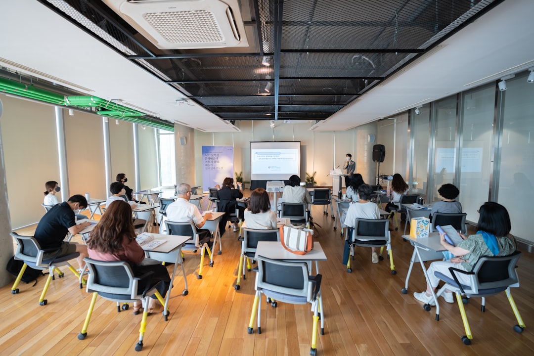 Professionals in a training session learning about AI for business