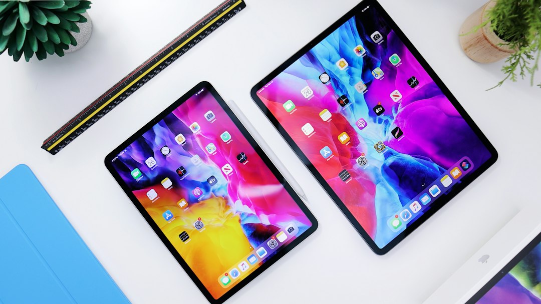 Several budget tablets arranged on a desk for comparison