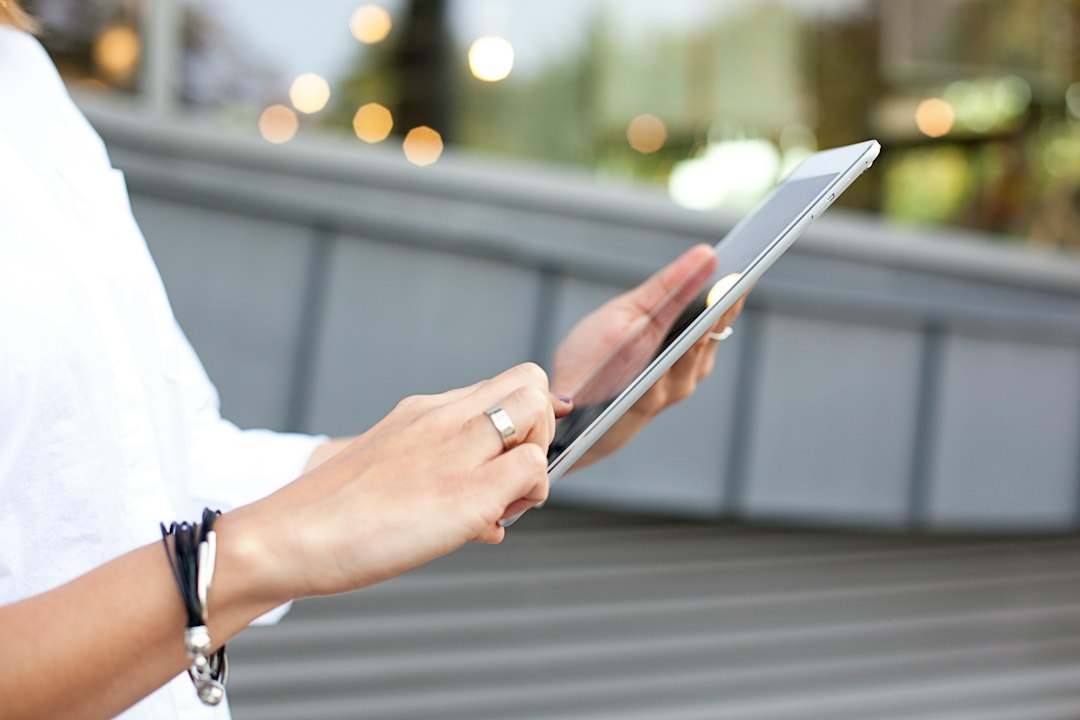 Student taking notes on a budget tablet with stylus during an online class