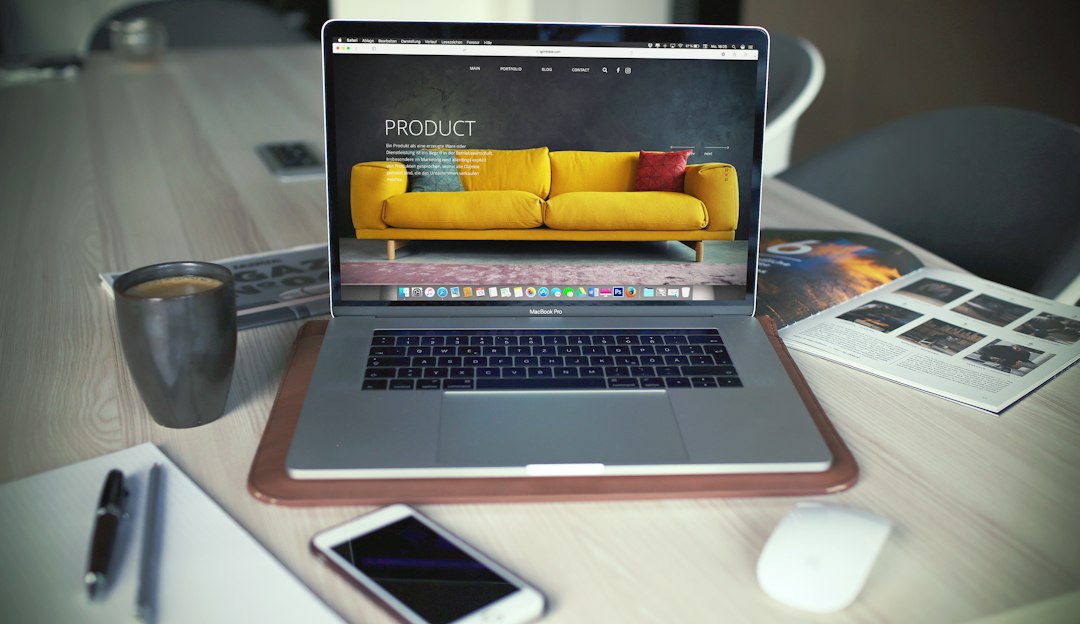 Small business owner setting up an online store on a laptop