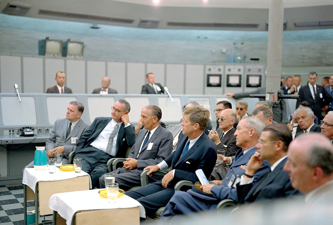 International delegates discussing AI policy around a conference table