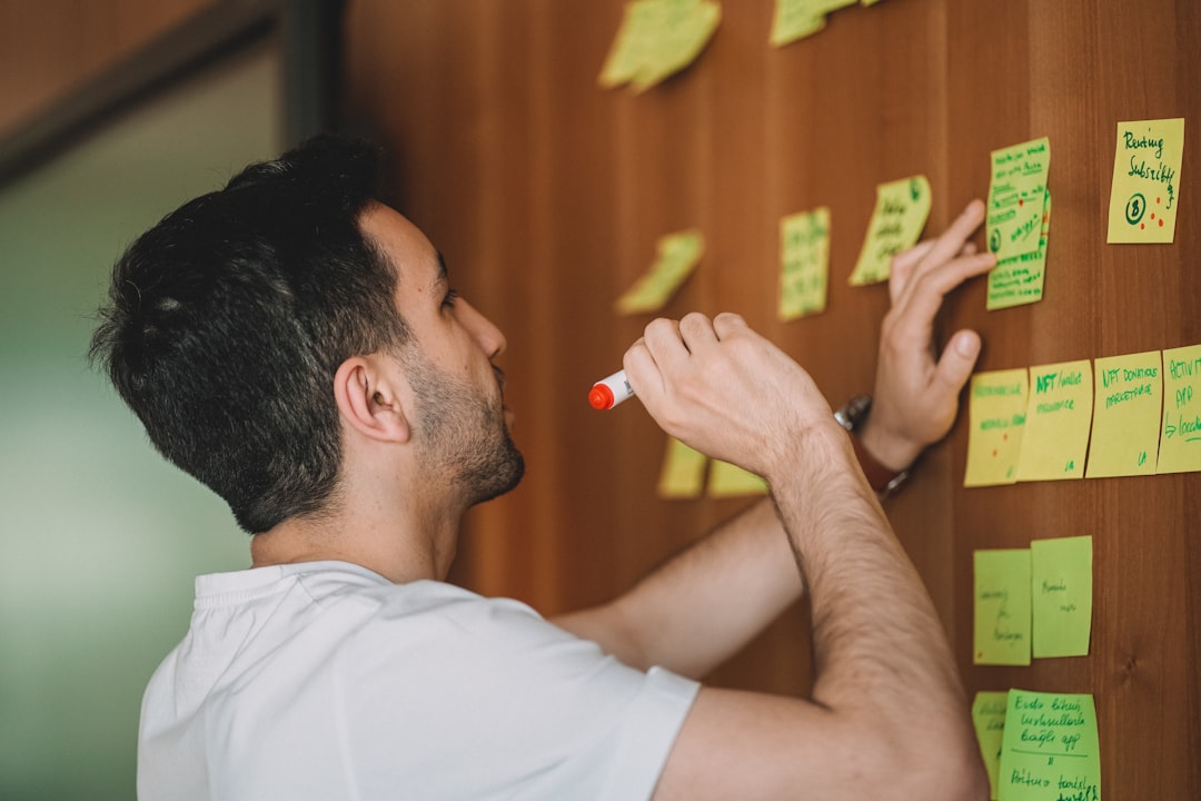 Startup founder planning an AI-powered SaaS product on a whiteboard