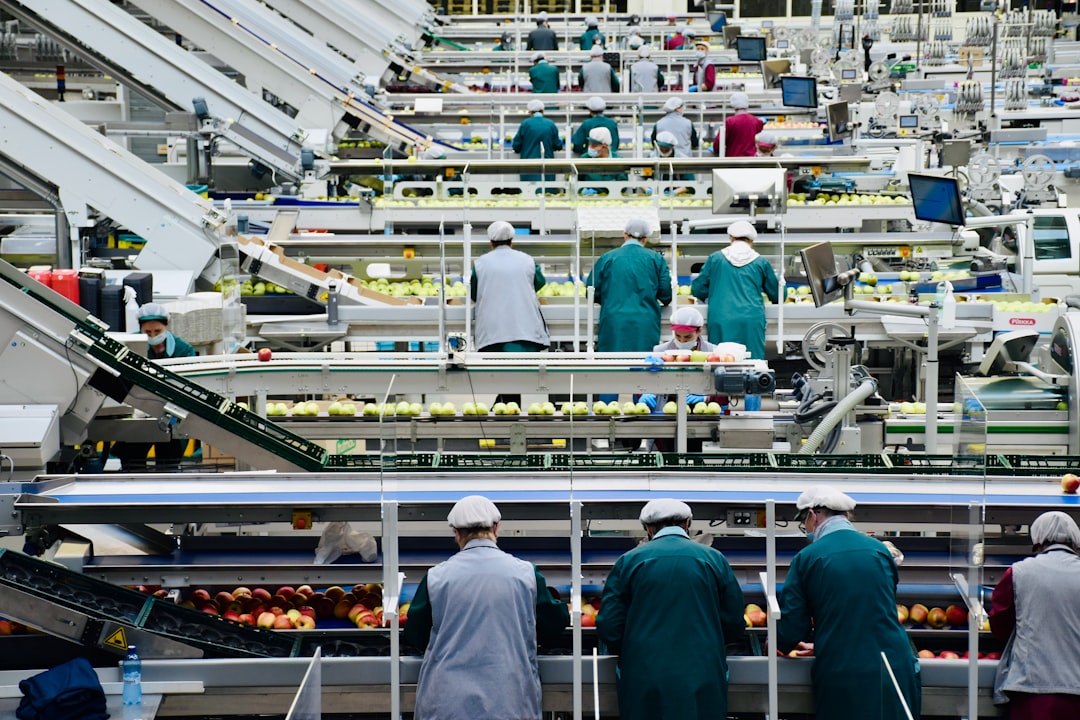 Industrial workers and machinery illustrating productivity and labour costs in manufacturing