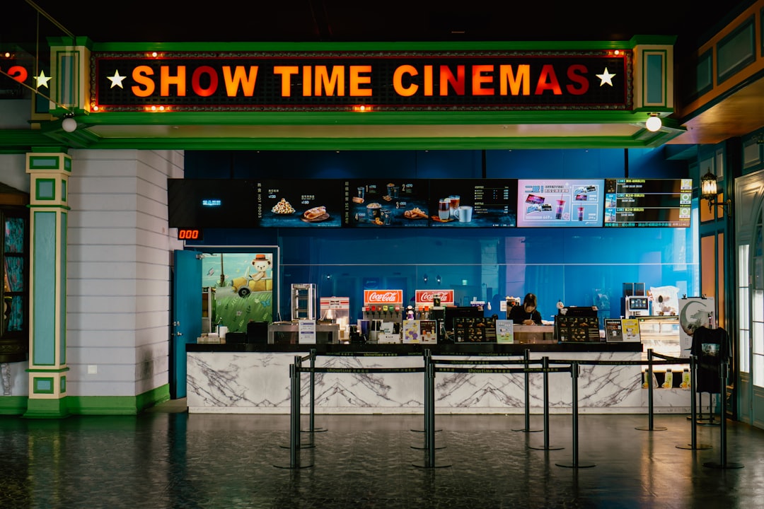 Cinema lobby with digital ticket kiosks and point of sale systems