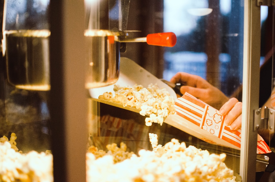 Cinema concession stand with staff using a point of sale terminal