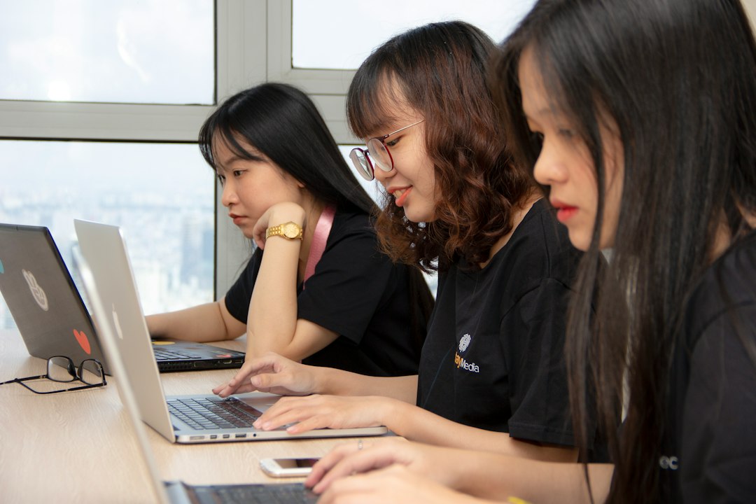 Team collaborating on AI-powered workflows using laptops