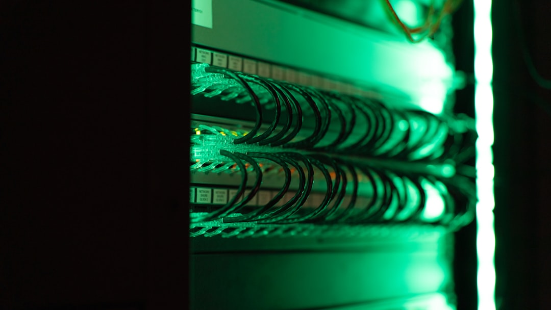 Server racks inside a modern data center with blue lights