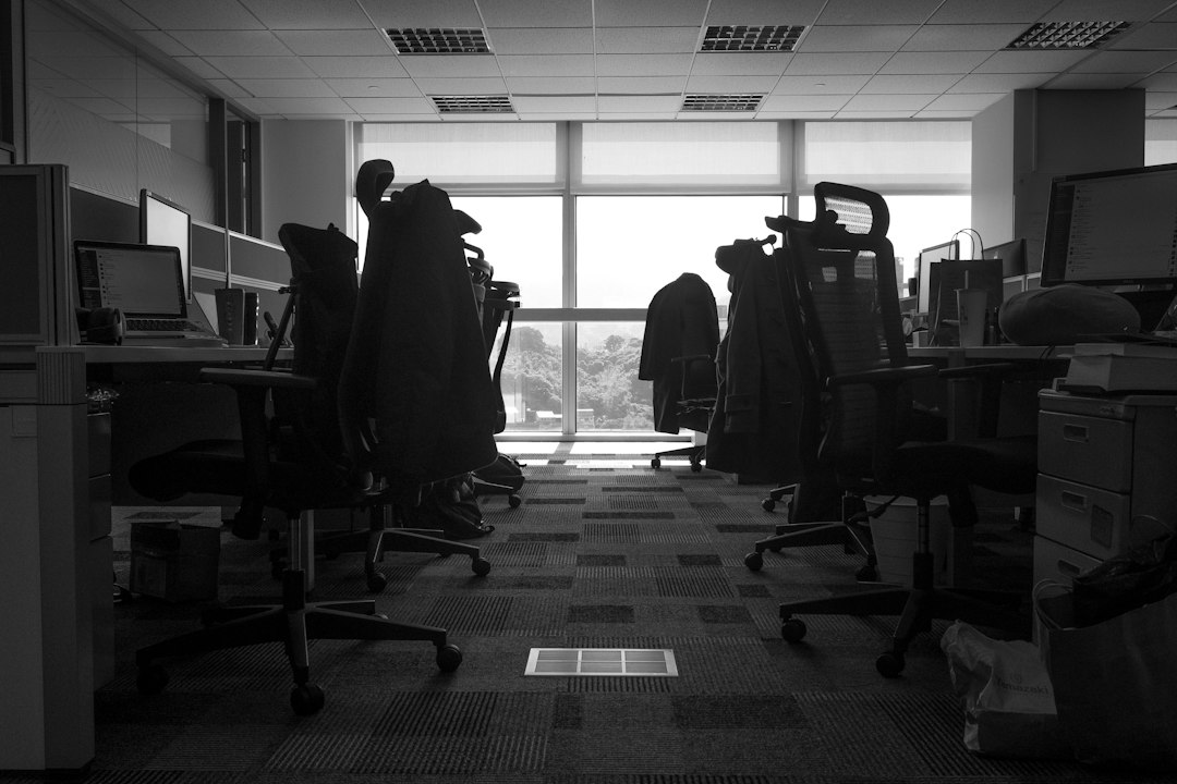 Office workers discussing data privacy and AI monitoring policies
