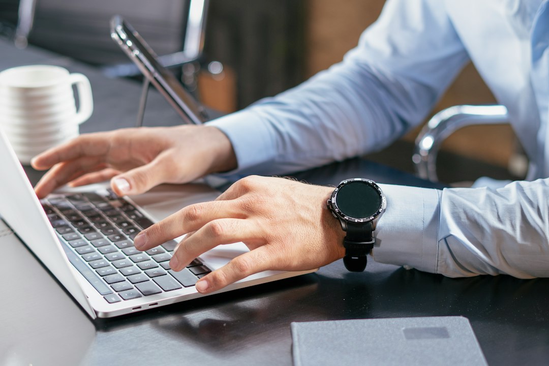 Professional checking an AI generated answer on a laptop using a checklist