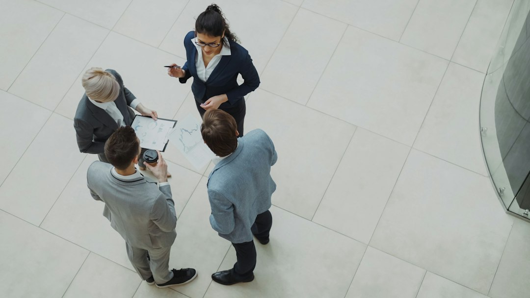 Business team discussing AI risks and verification steps around a table