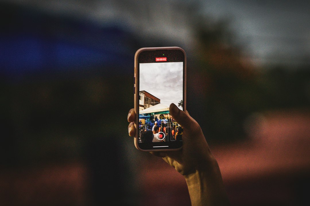 Photographer shooting with an iPhone in low light