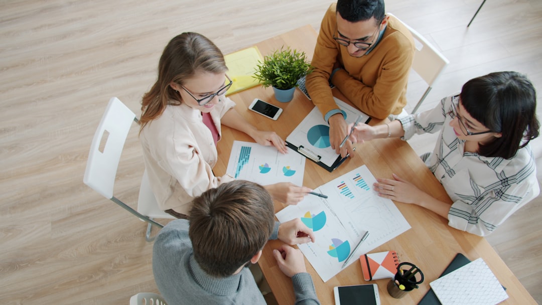 Business team reviewing restructuring strategy documents and charts