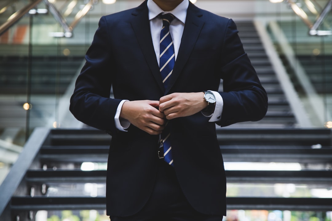 Professional considering a career change while looking out of an office window