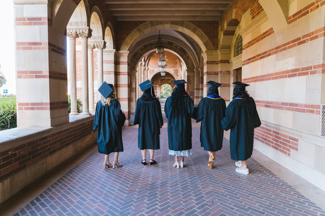 Students on a university campus being photographed for marketing materials