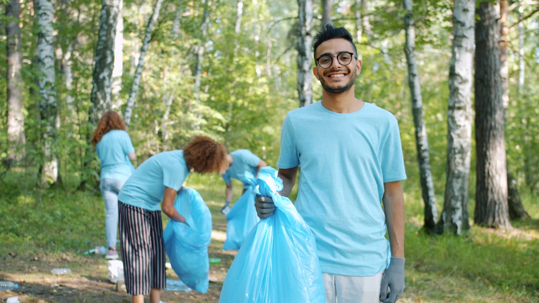 College students volunteering in a community garden during summer
