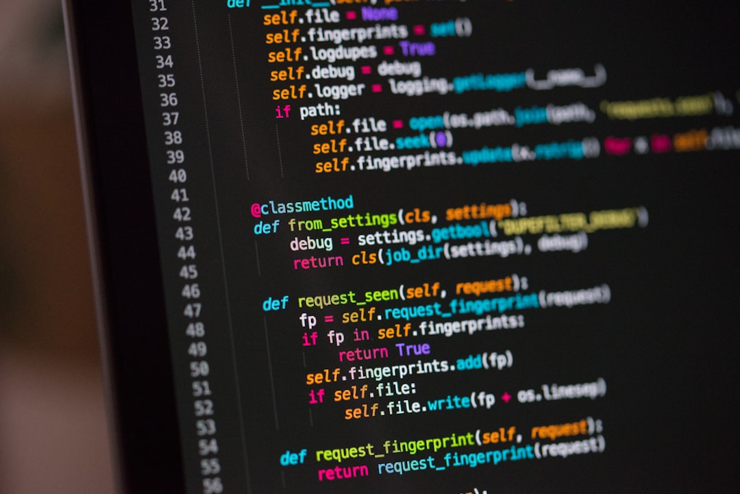 Software developer reviewing secure code on a laptop
