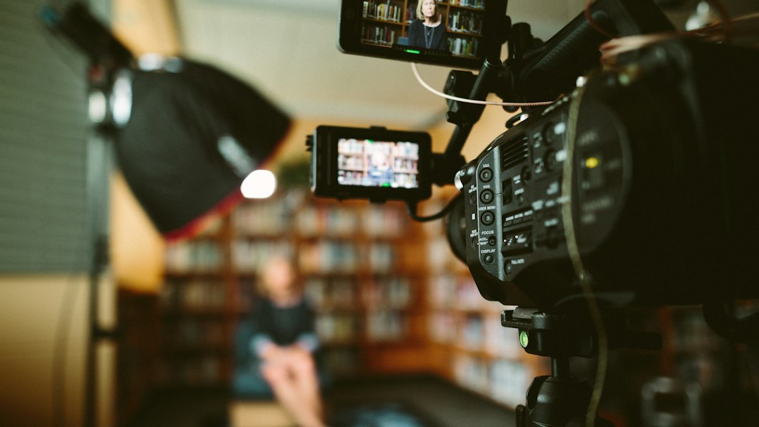Documentary director interviewing a subject in a studio setting