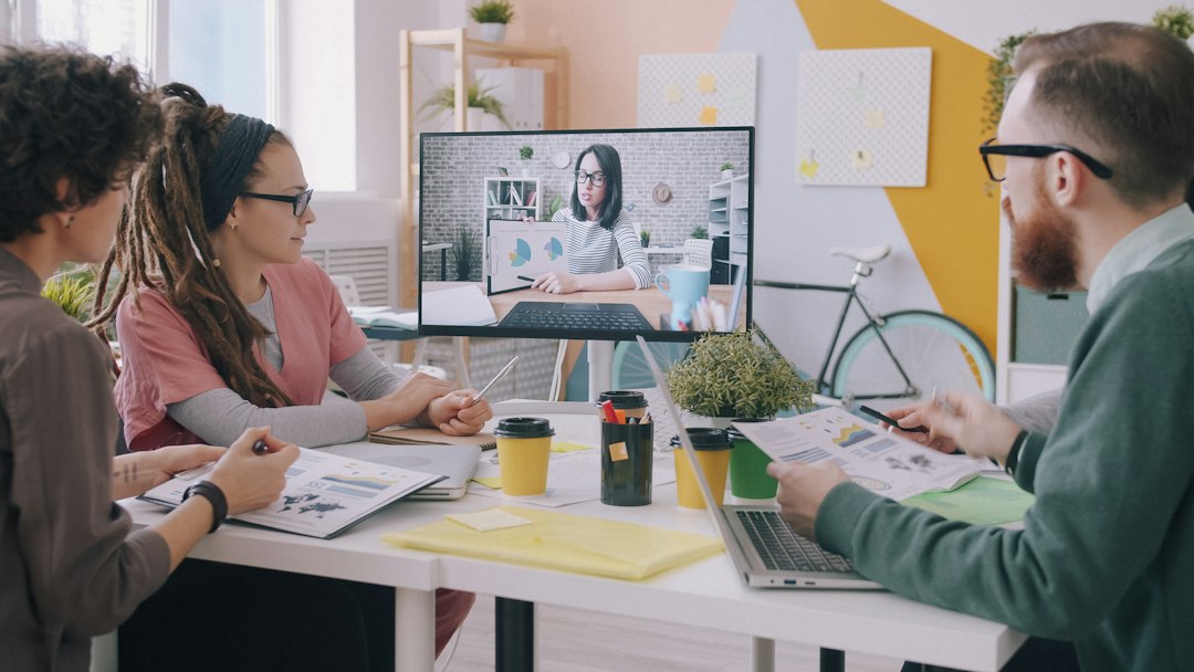 Manager leading a small AI training session with employees