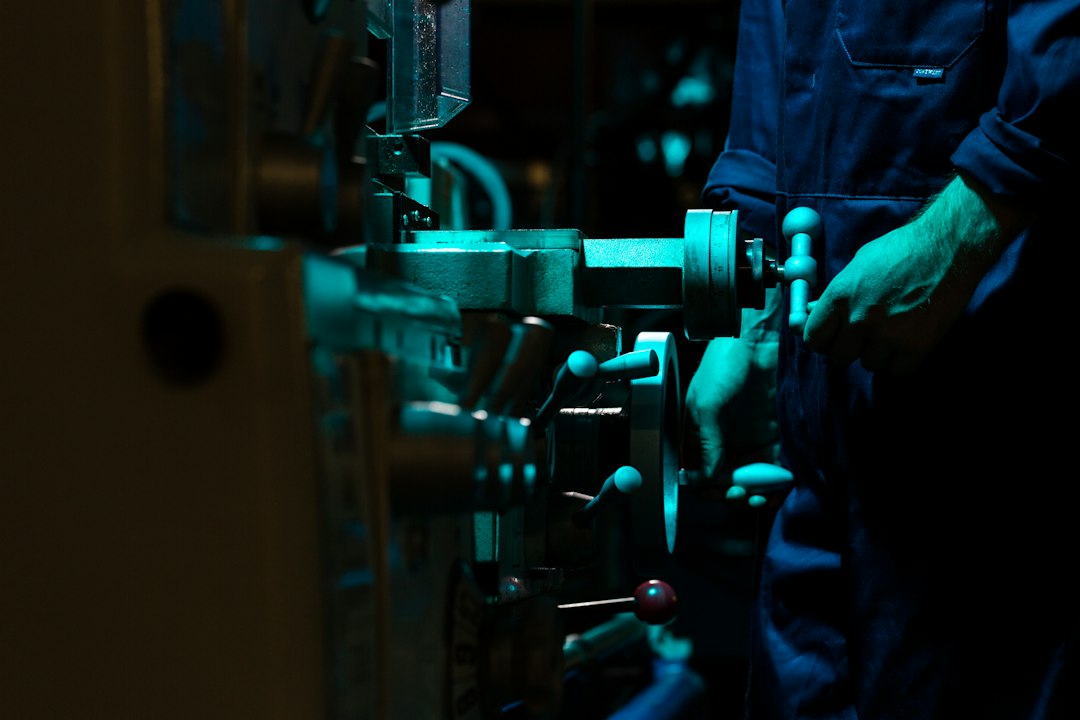Engineers in a factory using AI-driven dashboards to monitor operations