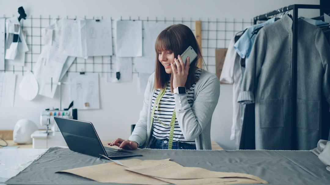 Small business owner in a shop answering a suspicious phone call