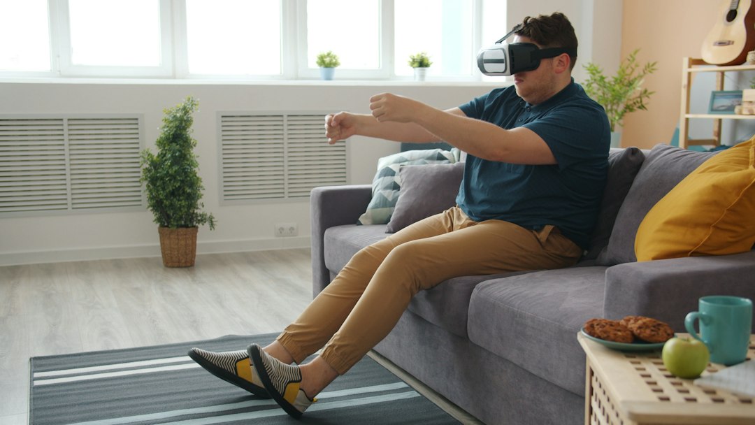 Person playing an immersive VR game in a living room