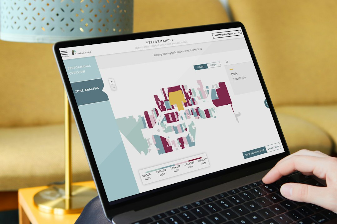 Policy professionals viewing a data dashboard on a laptop