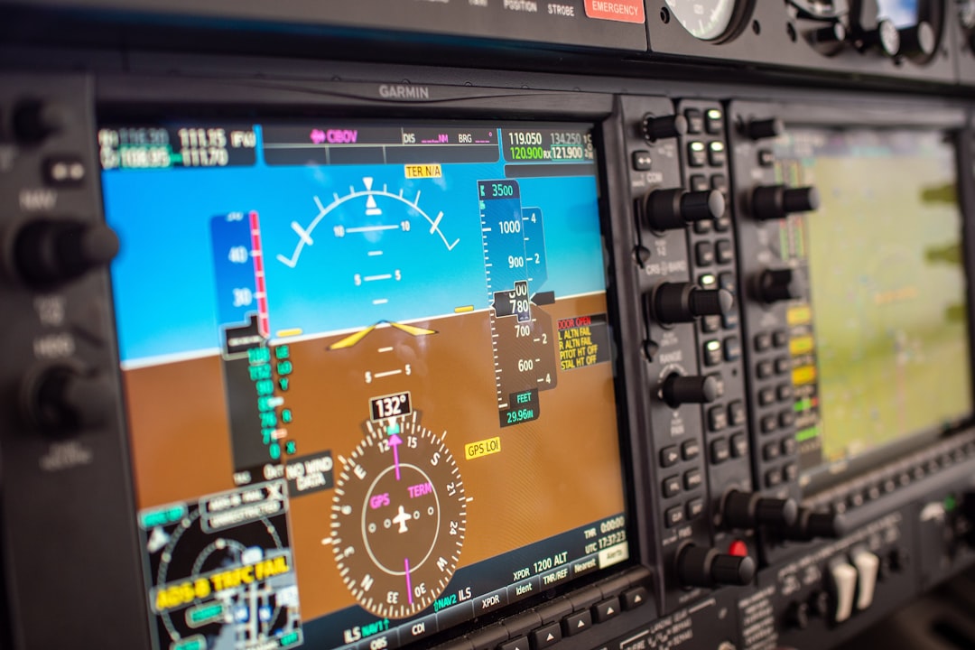 Airline operations control room with digital flight tracking screens