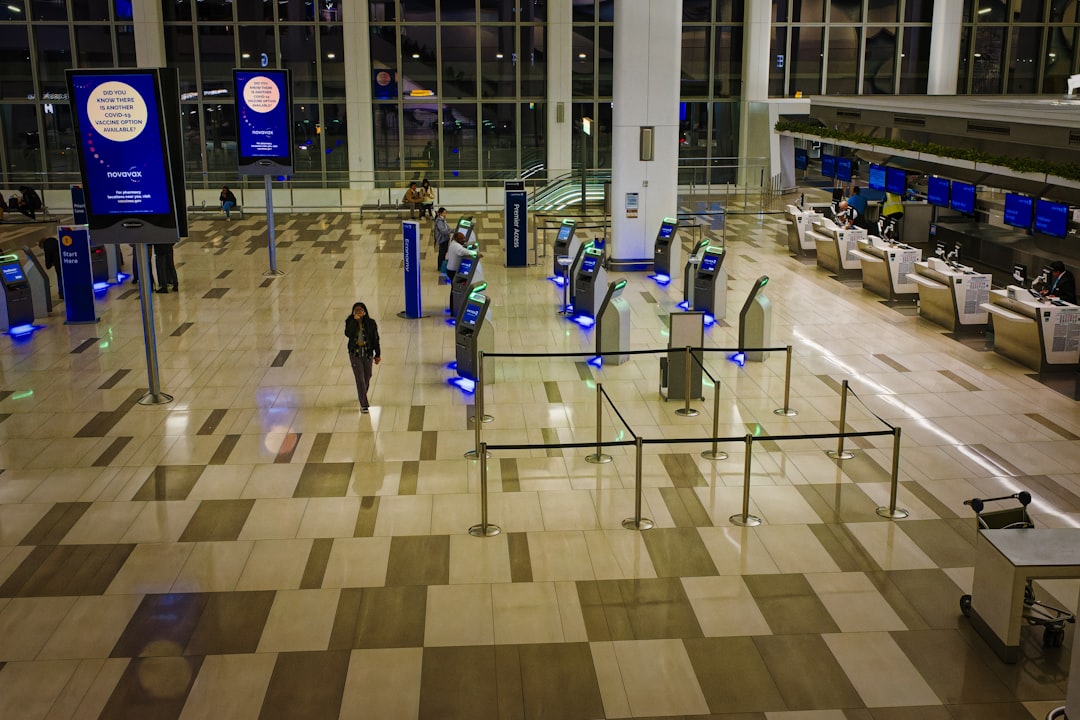 Airline passengers using digital boarding passes at the airport