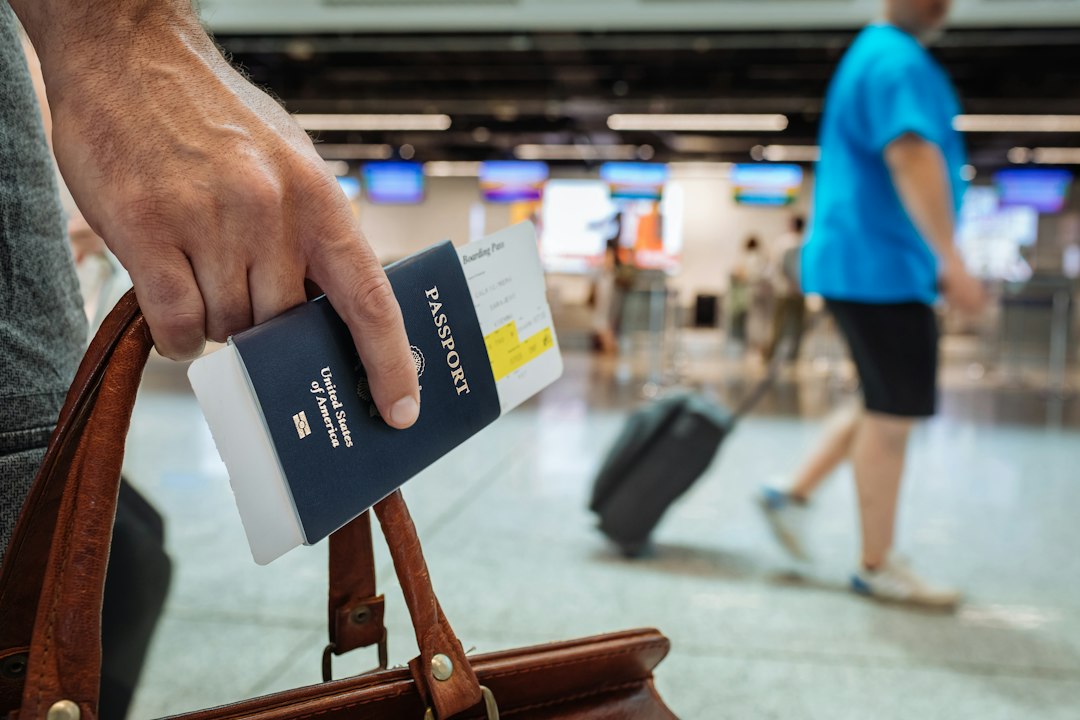 Airline passengers using mobile boarding passes and digital screens at an airport