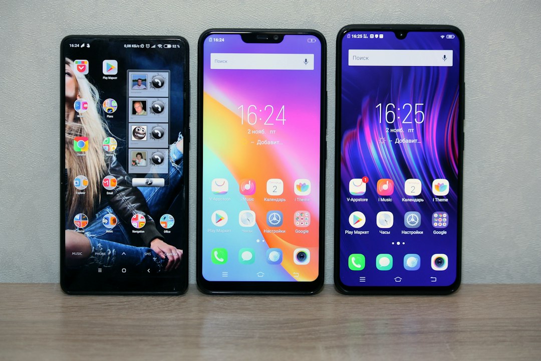 Person comparing smartphone prices on a laptop and phone