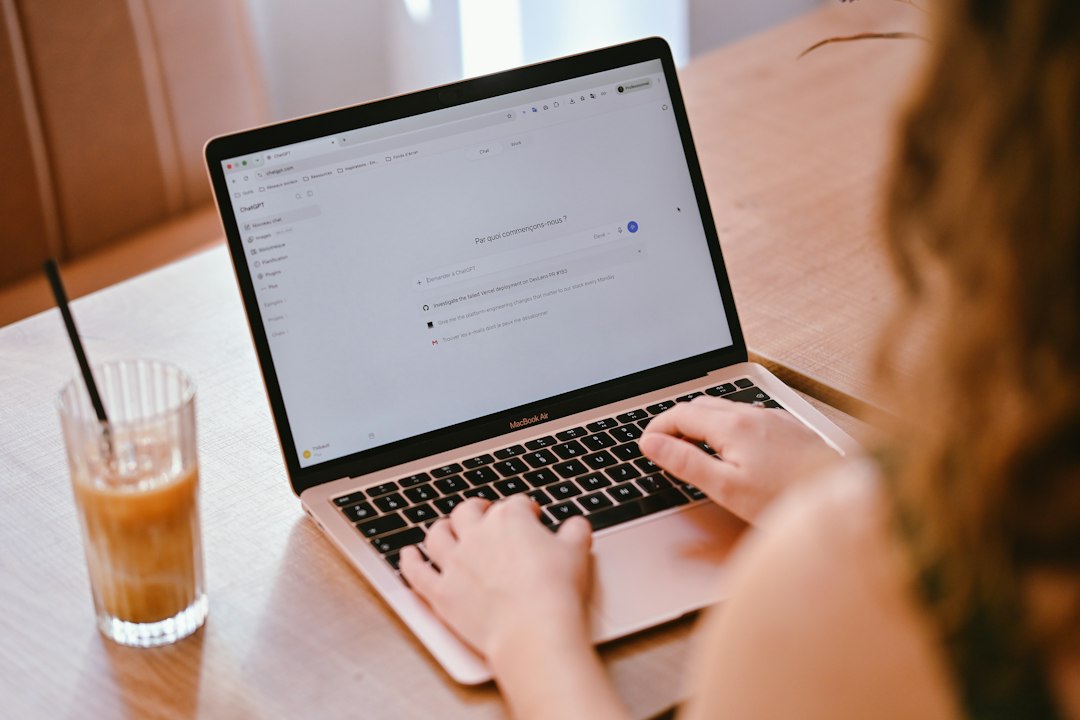 Customer using an AI chatbot to research a local business on a laptop