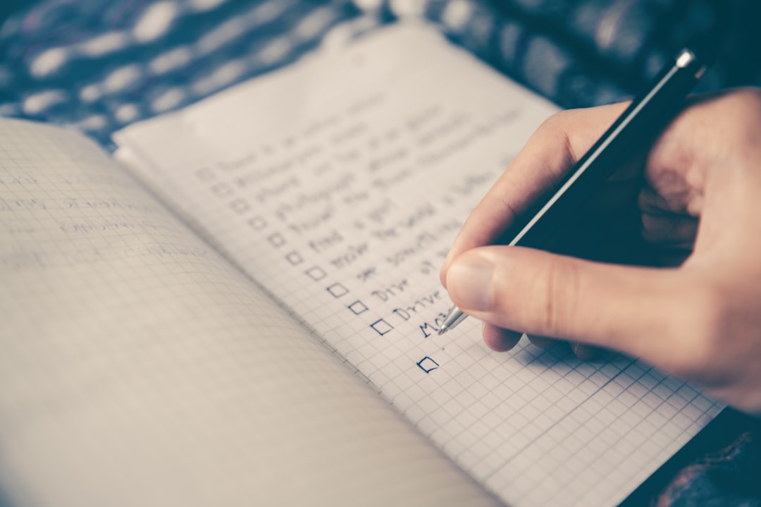 Student checking off tasks on a printed study checklist