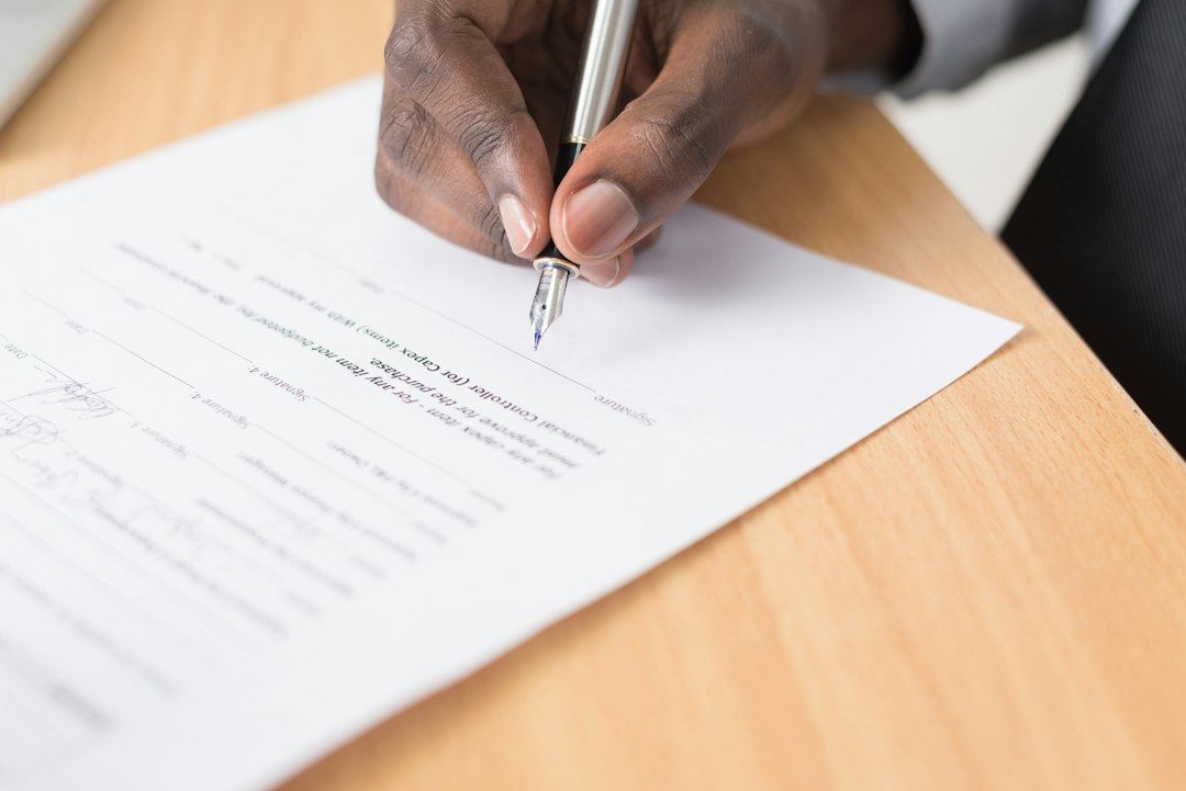 Business owner reviewing and signing a website service subscription agreement