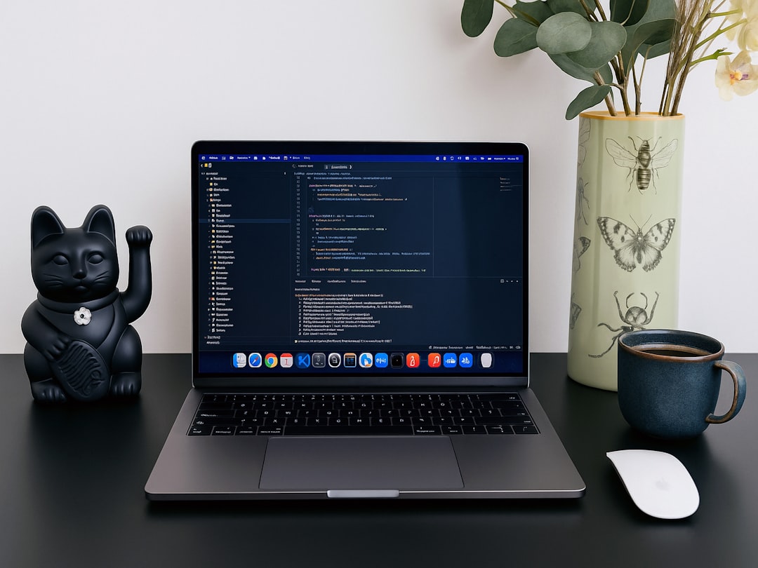 Laptop displaying an AI chatbot alongside a productivity app